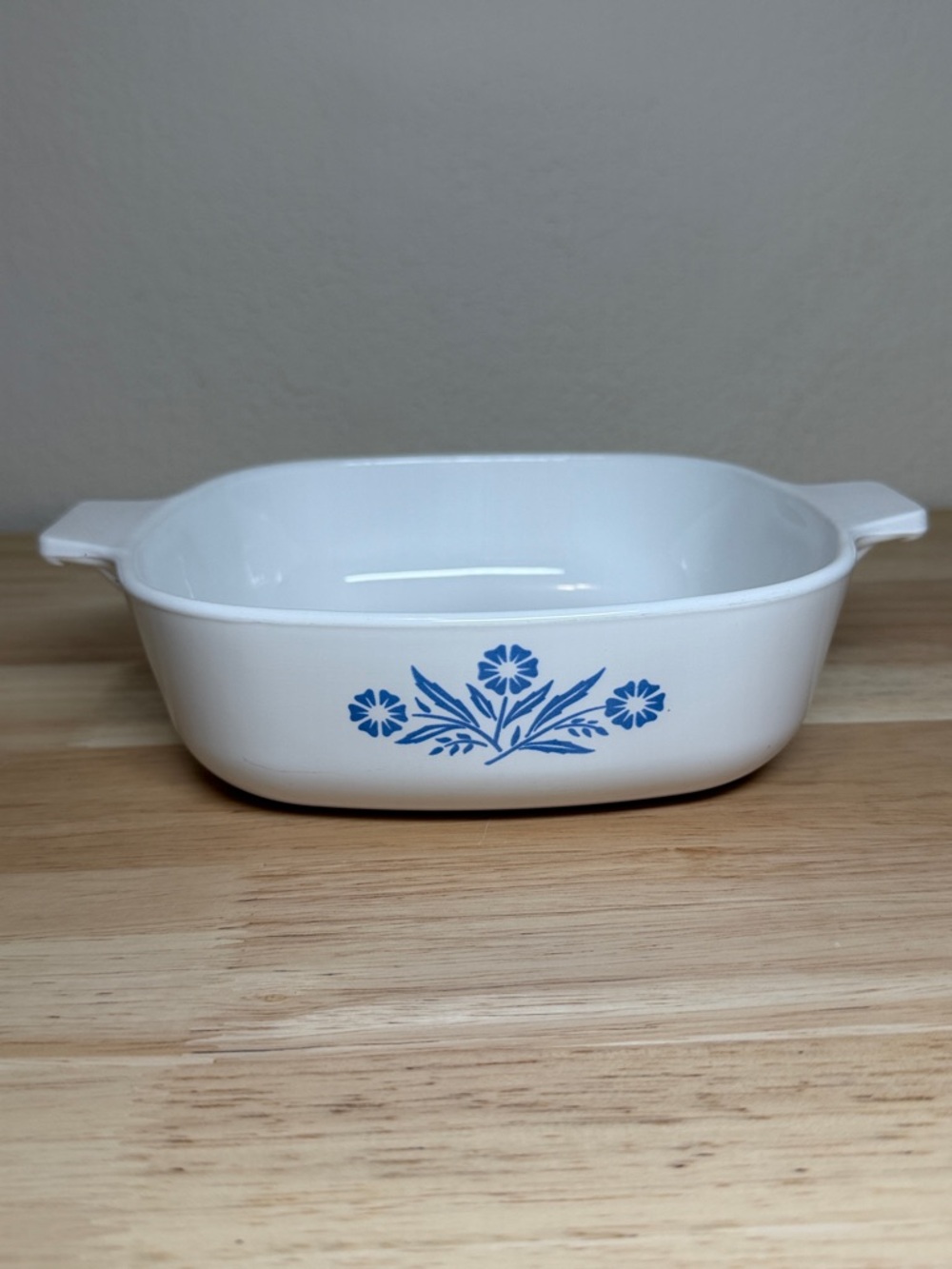 Vintage CorningWare casserole dish in the iconic "Blue Cornflower" pattern.